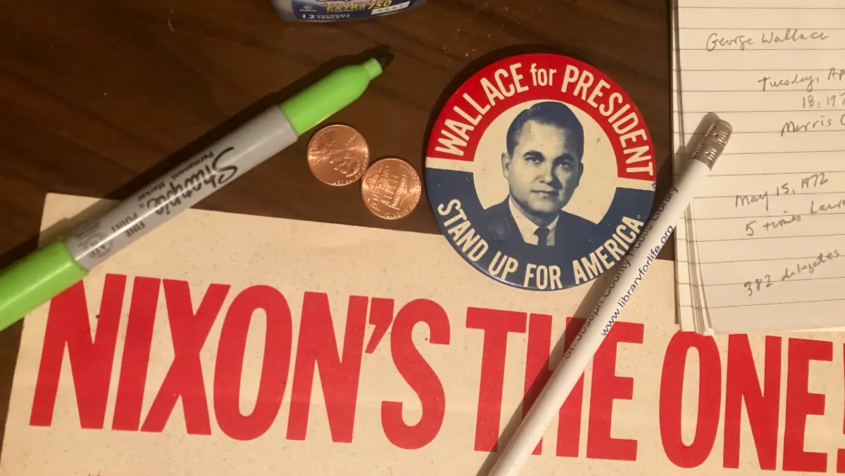 Photograph of campaign memorobilia, including a 1968 George Wallace pin