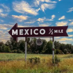 Road sign points toward Mexico, Indiana