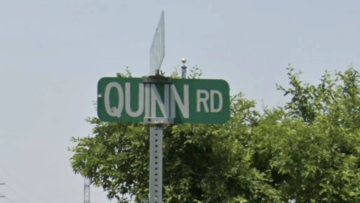 Photograph of street sign at Quinn Road