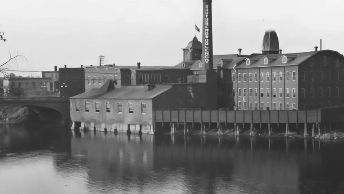Historic photograph shows the smokestack at the South Bend Woolen Mill factory.