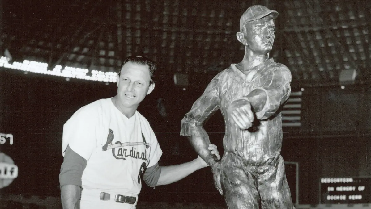 Stan Musial poses with a statue of Dick Kerr.