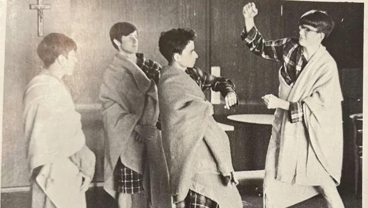 Wendell Walsh prepares to strike Bob Prevost during a high school performance of Julius Caesar