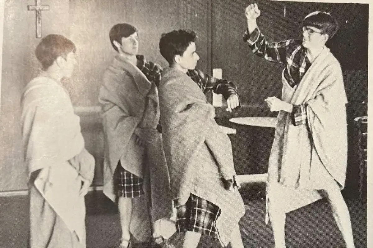 Wendell Walsh prepares to strike Bob Prevost during a high school production of Julius Caesar.